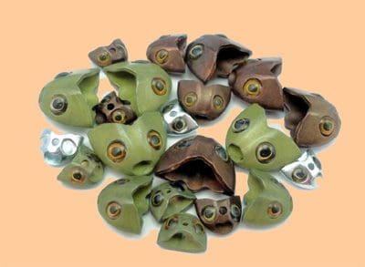 A cluster of small, animal-shaped ceramic planters with faces and open tops.