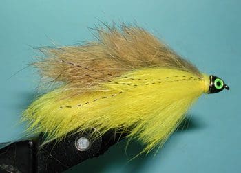 A collection of shiny metallic chess pawns arranged on a peach background.