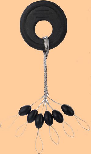 A collection of shiny metallic chess pawns arranged on a peach background.