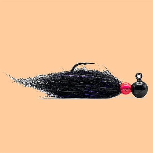 Black fishing lure with a red bead and weighted head.