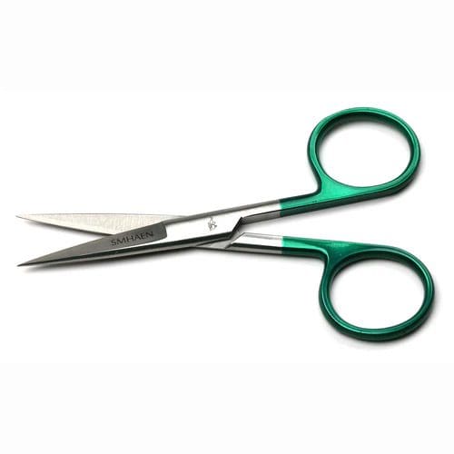 Small green-handled scissors isolated on white background.