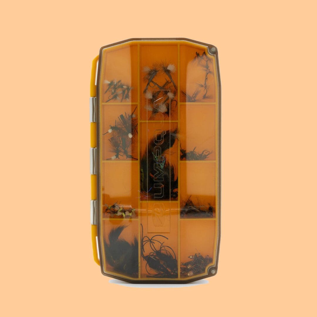 Top view of an orange toy bus with black and gray details.