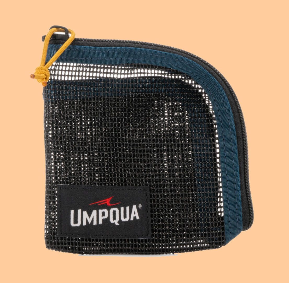 Small black mesh pouch with a zipper and UMPQUA logo.