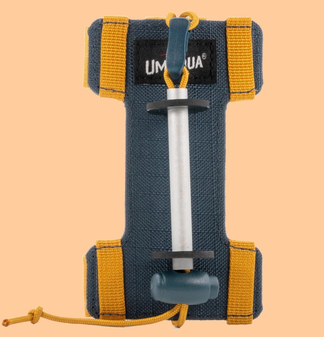 A backboard stretcher with straps and handles for patient transport.