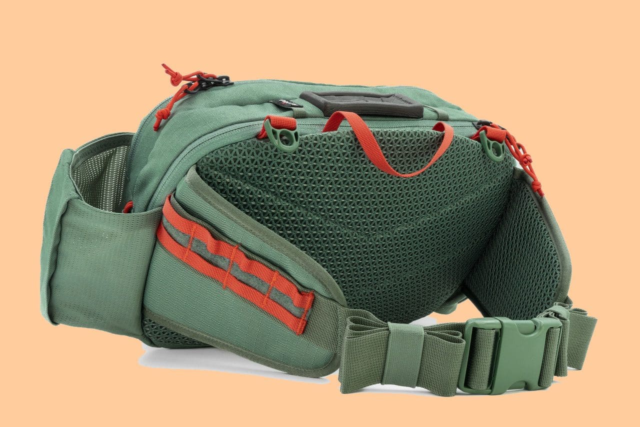 Green waist bag with red accents and mesh back panel.